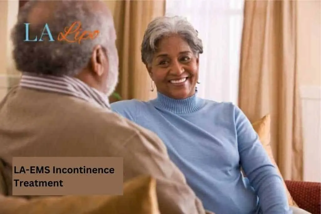 Couple sat smiling at each other - LA-EMS treatment Leeds
