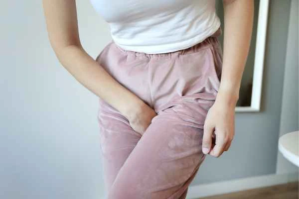 woman running for the toilet because of urinary incontinence Leeds